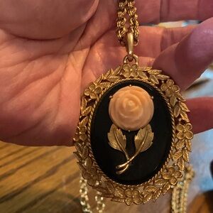 1920”s Gold and Black Floral Pendant Necklace on one side with a mirror on th PI